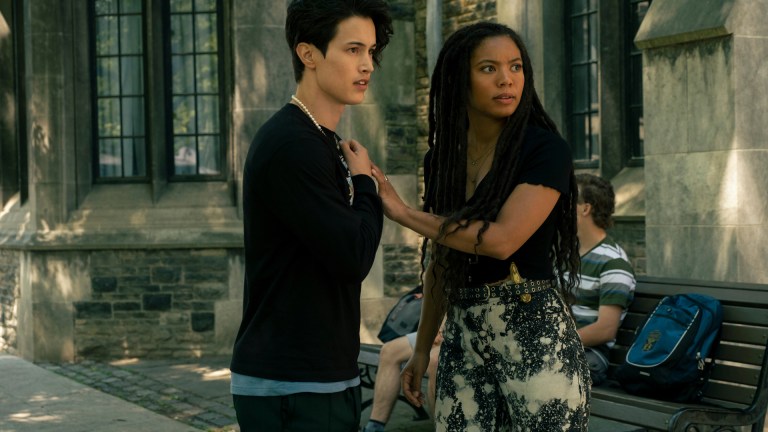 Derek Luh (Jordan Li) and Jaz Sinclair (Marie Moreau) stand in a God U courtyard
